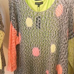 light gray top, designs in green and orange., by F